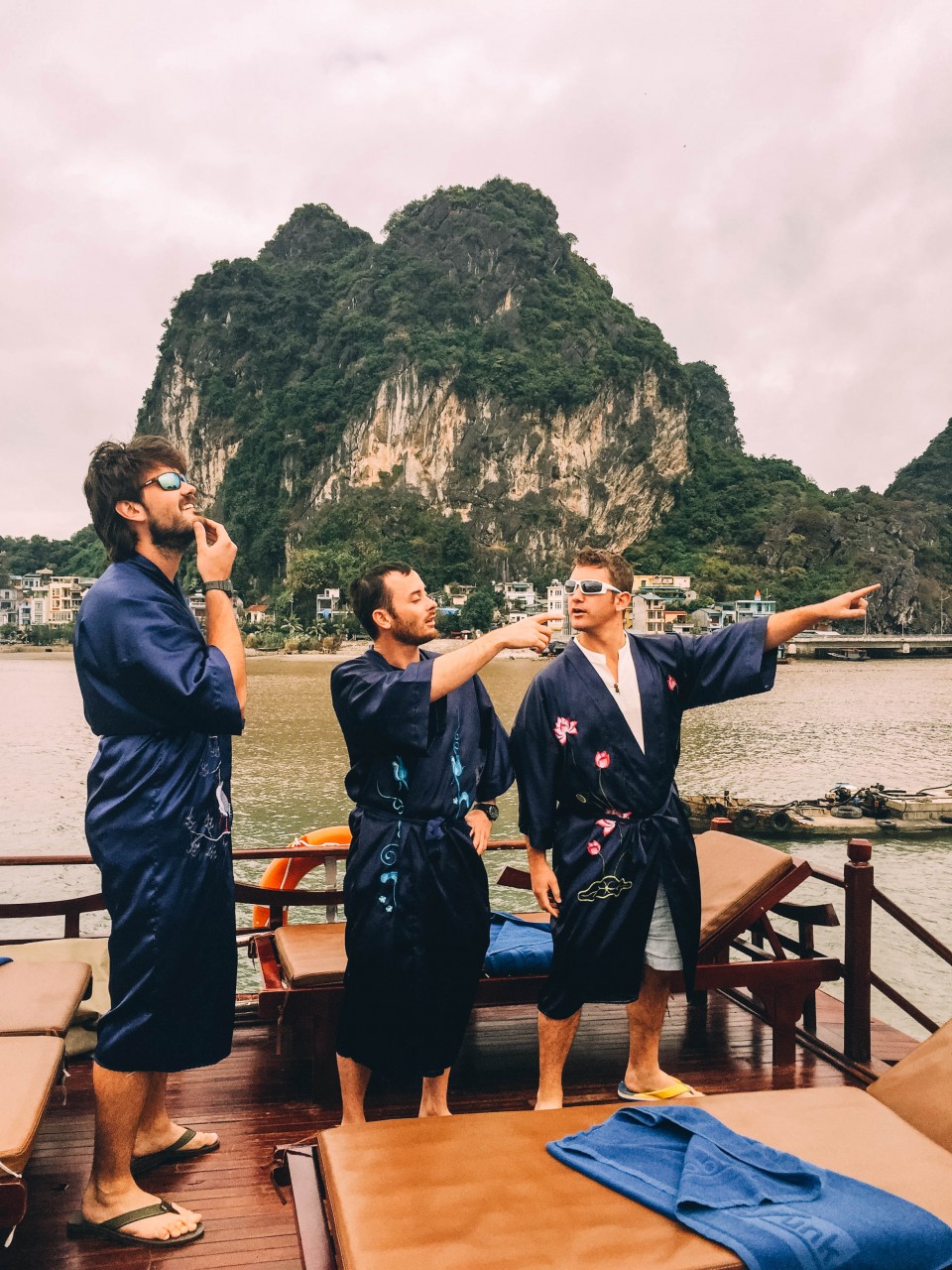 Watching sunset in Indochina robes in Halong Bay, Vietnam